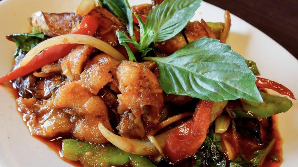 Basil Salmon · Grilled salmon stir fried in a spicy basil sauce topped with basil, bell peppers, young pepper corn, bamboo, carrots, onions,
and mushrooms