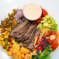 Spicy Taco Salad · Romaine, iceberg, roasted corn salad, cilantro, red onions, tomatoes, roasted cauliflower, r...