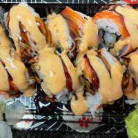Yummy Roll · Spicy. Inside shrimp tempura, topped with crab meat, eel sauce, and spicy mayo.