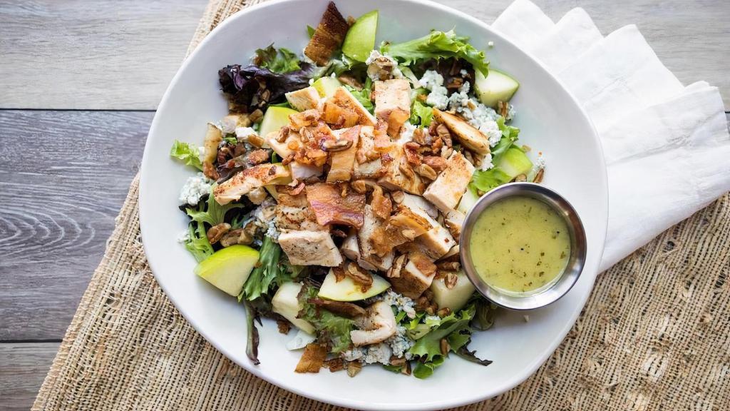 Waterloo Salad · Seasoned grilled chicken, bacon, toasted pecans, Granny Smith apples& bleu cheese crumbles on mixed greens topped with Apple Cider Vinaigrette.