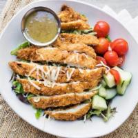 Crispy Chicken Salad · Crispy chicken breast, cucumbers, cherry tomatoes, shredded carrots, and jack cheese served ...