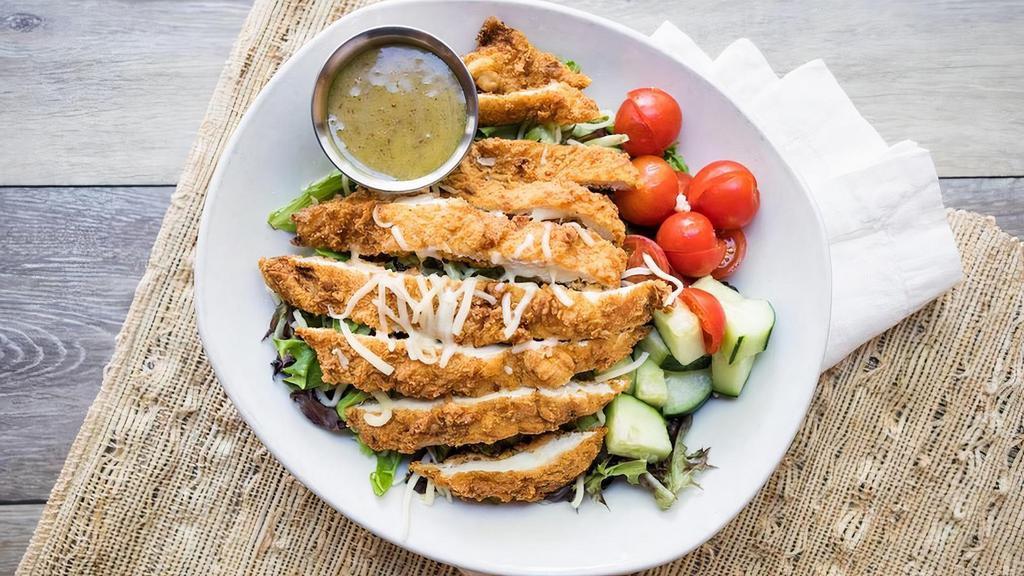 Crispy Chicken Salad · Crispy chicken breast, cucumbers, cherry tomatoes, shredded carrots, and jack cheese served with housemade honey mustard dressing