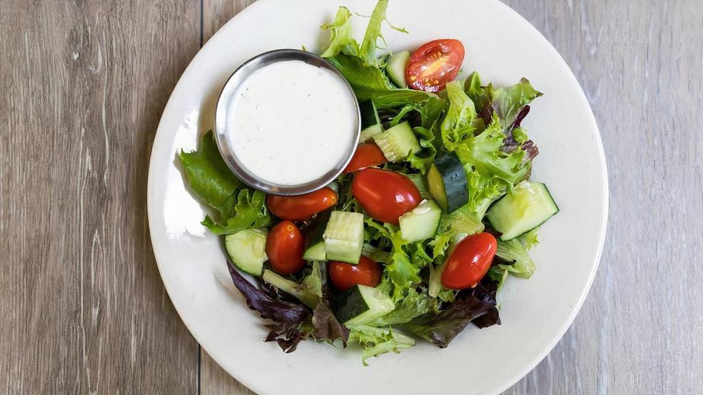 House Salad · Fresh cucumber, tomato, and shredded carrots on a bed of mixed greens. Served with your choice of dressing