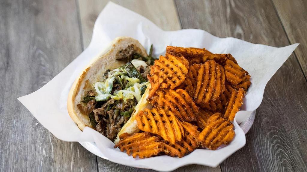 Texas Philly · Thinly Shaved beef sirloin or fajita chicken, Queso Blanco, caramelized onions and grilled poblano peppers on a toasted hoagie.  We serve the queso on the side for to go orders