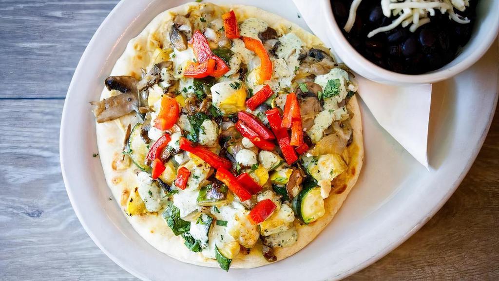 Veggie Sandwich · Grilled zucchini, squash, mushrooms, onions & red bell peppers with hummus, melted jack cheese & cilantro lime crema. Served open-faced on pita bread.