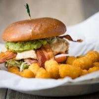 Guacamole Bacon Swiss · Bacon, swiss cheese, guacamole, lettuce, tomatoes & onions with mayo with your choice of pat...