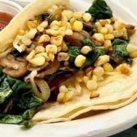 Veggie Tacos · Two tacos stuffed with grilled mushrooms,onions, sauteed spinach melted jack cheese and fres...