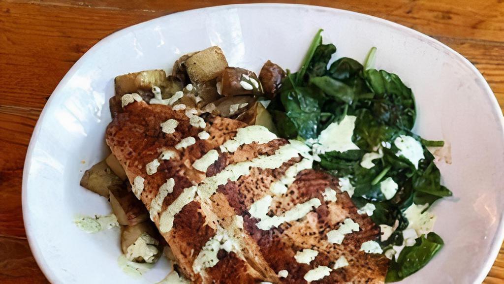 Grilled Ruby Trout · Fresh Ruby Trout seared on the grill and topped with cilantro lime crema.  You can choose any two sides, but Chef Clayton recommends seasoned diced potatoes and spinach.