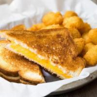 Kid Grilled Cheese · A traditional grilled cheese sandwich with white bread and American cheese.  Served with one...