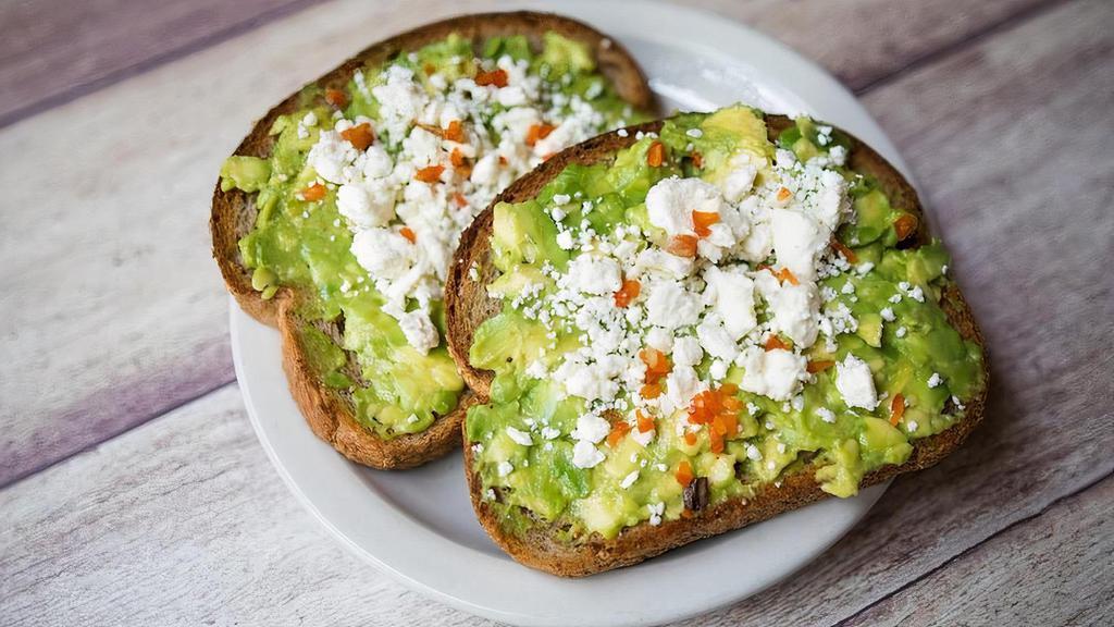Avocado Toast · Whole wheat toast topped with smashed avocado and olive oil, sprinkled with feta cheese & red pepper flakes
