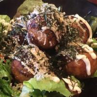 Takoyaki · Deep-fried breaded octopus balls served with Japanese mayo, katsuobushi (bonito flakes), and...