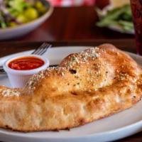 Stromboli Calzone · Pepperoni, Italian sausage, mushrooms, black olives, bell peppers, Wisconsin mozzarella and ...