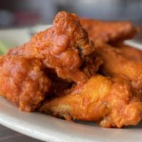 Liberty Wings Spicy Buffalo · 10 jumbo spicy wings fried and served in our signature buffalo sauce and served with a side ...