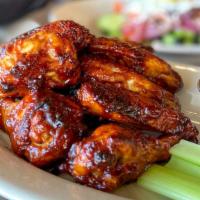 Liberty Wings Bbq · 10 jumbo BBQ wings fried and served in our signature BBQ sauce and served with a side of ran...