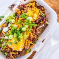 Baked Potatoes · Loaded with choice of meat and toppings. Chopped brisket, sausage, pulled pork or chicken. B...