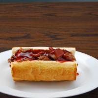 Bbq Beef Sandwich · Smothered in zesty sauce.