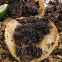 Al Pastor Taco · Roasted meat. Onions cilantro red and green salsa side of frijoles charros.