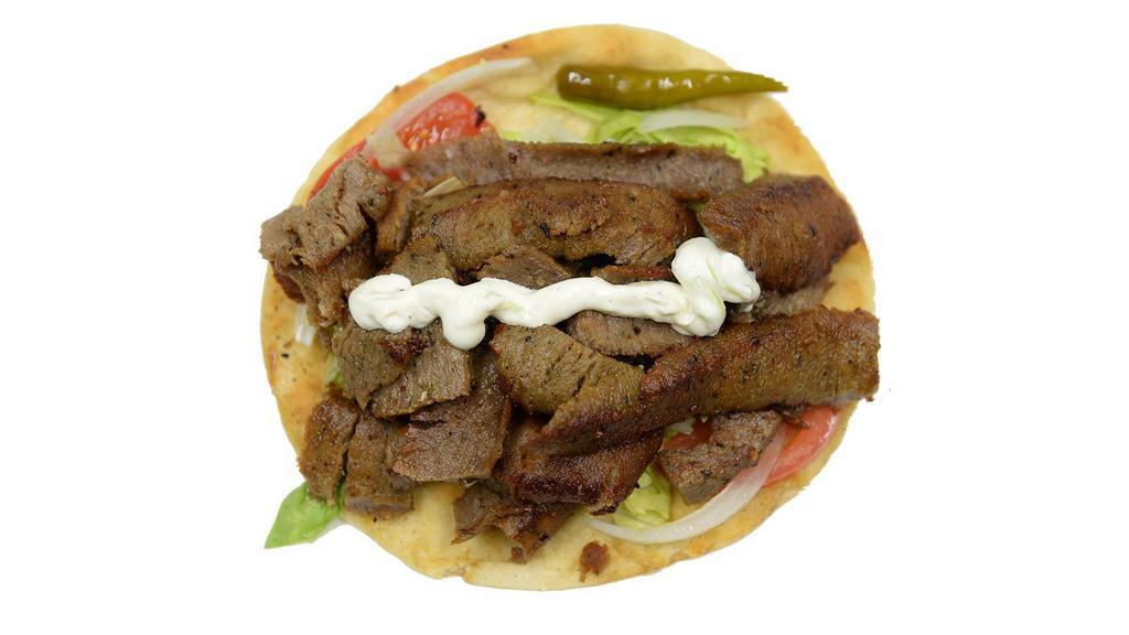 Gyro Wrap · Our famous Chicago style lamb and beef gyro. served with homemade tzatziki sauce, lettuce, onions, tomatoes and sport pepper. Please specify any preparation instructions below.