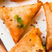 Beef Samosa (2 Pc) · Cripy pastry stuffed with ground beef, coriander leaves with mild spices and herbs.