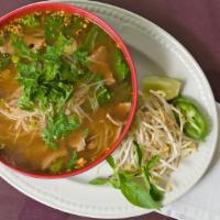 Thai Esan Spicy Noodle Soup - (Tom Yum) · Choice of meat in rice noodle and mixed greens in our signature house-made broth added with ...