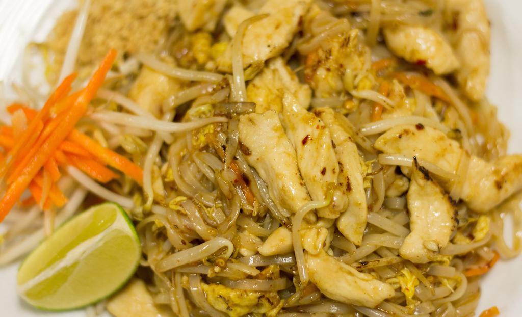 Pad Thai · Stir-fried egg in fresh rice noodle, bean sprouts and carrots with signature sauce. Garnished with crushed peanuts and lime.