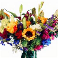 Sunshine  · Designer choice vase. Medium arrangement. Seasonal fillers, sunflowers, roses, carnations, s...