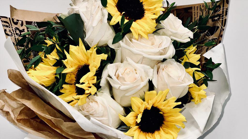 White Roses & Sunflowers Wrapped  · White roses and sunflowers wrapped in bouquet