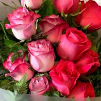 Dozen Pink Wrapped Roses · Pink Roses, Greenery, Babies Breath Wrapped.