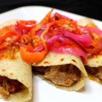 Tacos · De bistec, cochinita pibil, o tripa tortillas hechas a mano y regular. / Steak, cochinita pi...