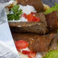 Gyro · Slices of mixed beef and lamb meat broiled over time, served with lettuce, tomato pickles an...
