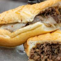 Philly Cheesesteak · Minced tender chopped beef with gooey, caramelized onions, all on a toasted and buttered hoa...
