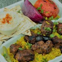 Beef Tikka · Two marinated beef skewers charbroiled for a smoky flavor set on top of a bed of basmati ric...