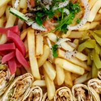 Chicken Shawarma · Wraps cut into pieces for family sharing. Served with fries, salad and garlic sauce.