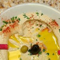 Hummus · A purée of ground chickpea made with tahini, garlic, and lemon.