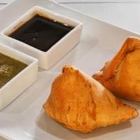 Samosa (2 Pcs) · Delicious pastry shells filled with seasoned potato and peas.