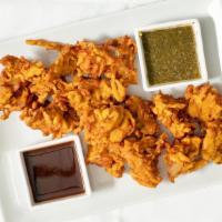 Mixed Vegetable Pakoda · Mixed vegetables dipped in gram flour batter, spices, and fried.