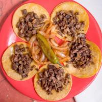 Regular Bistek Tacos · A plate of five steak tacos.  Comes with charro bean soup, lemon wedges, lemon wedges, green...