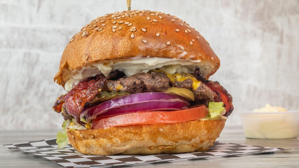 Bacon Cheese Burger · Beef patty, with melted American cheese, bacon, lettuce, tomato, onions, pickles and mayo