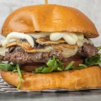 Shroom Burger · Fresh beef patty with aged melted Swiss cheese with arugula, sauteed mushrooms, tomatoes, on...
