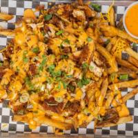 Nash Me Up Fries (Medium) · Fresh marinated chicken fried , dipped in Nashville sauce , fresh cut fries with shredded Am...
