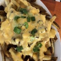 Chili Cheese Fries · Fresh fried crispy potatoes. Homemade beef chili topped with cheese.