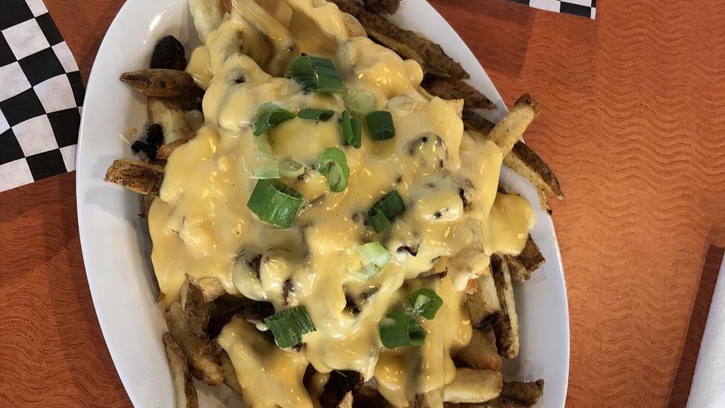 Chili Cheese Fries · Fresh fried crispy potatoes. Homemade beef chili topped with cheese.