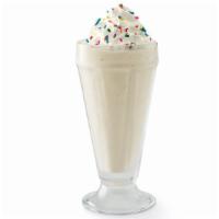 Vanilla Milkshake · Creamy soft-serve blended with milk and vanilla syrup. Garnished with whipped cream and rain...