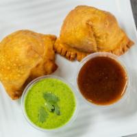 Vegetable Samosa · Vegetarian. Triangular pastry stuffed with potatoes, peas, herbs & spices.
