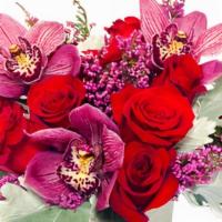 Dozen Red Roses With A Twist · This arrangement is an example of our dozen roses arranged pave style. Because we are known ...