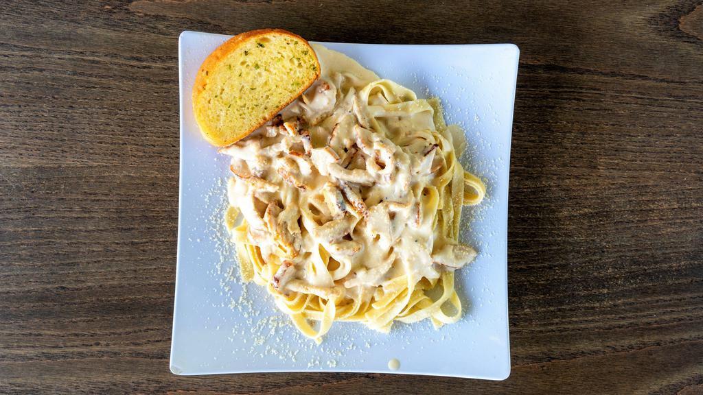 Fettuccine Alfredo · All pasta is homemade and served with garlic bread.