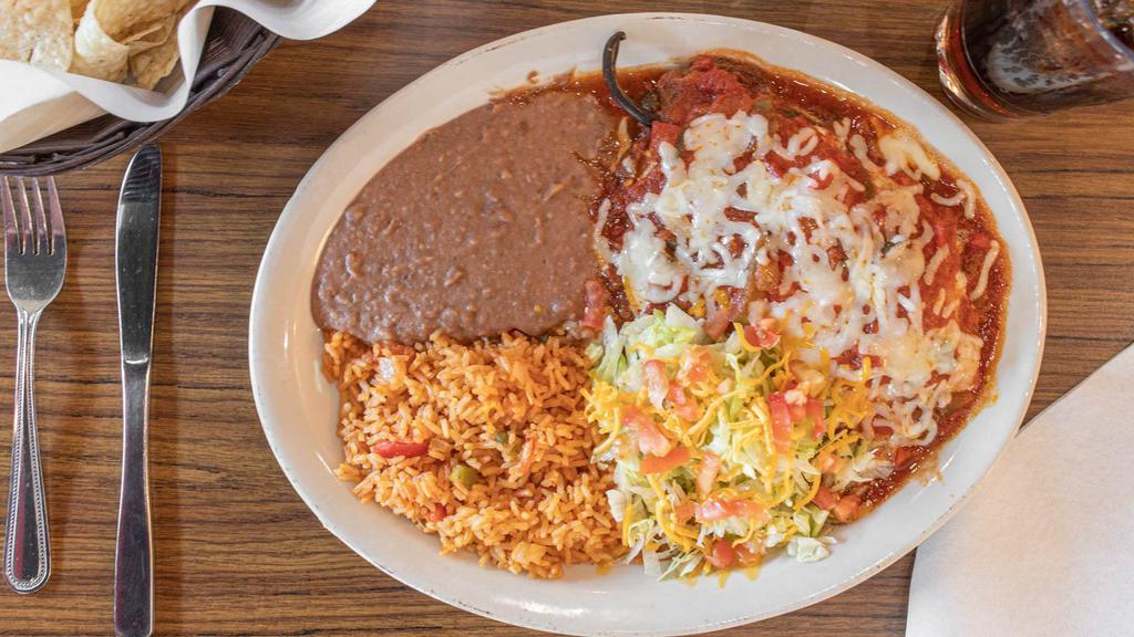 Chile Relleno · Poblano pepper stuffed with ground beef or shredded chicken and fried in egg batter. Topped with ranchero or cilantro sauce and melted chedder cheese, served with side salad.