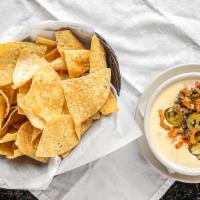 Casamia'S Queso · White or yellow queso, ground beef, pico de gallo and jalapeños.