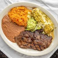 Carne Asada · A tender grilled 8.5 oz round top sirloin steak, charbroiled, then, served with a side of gu...