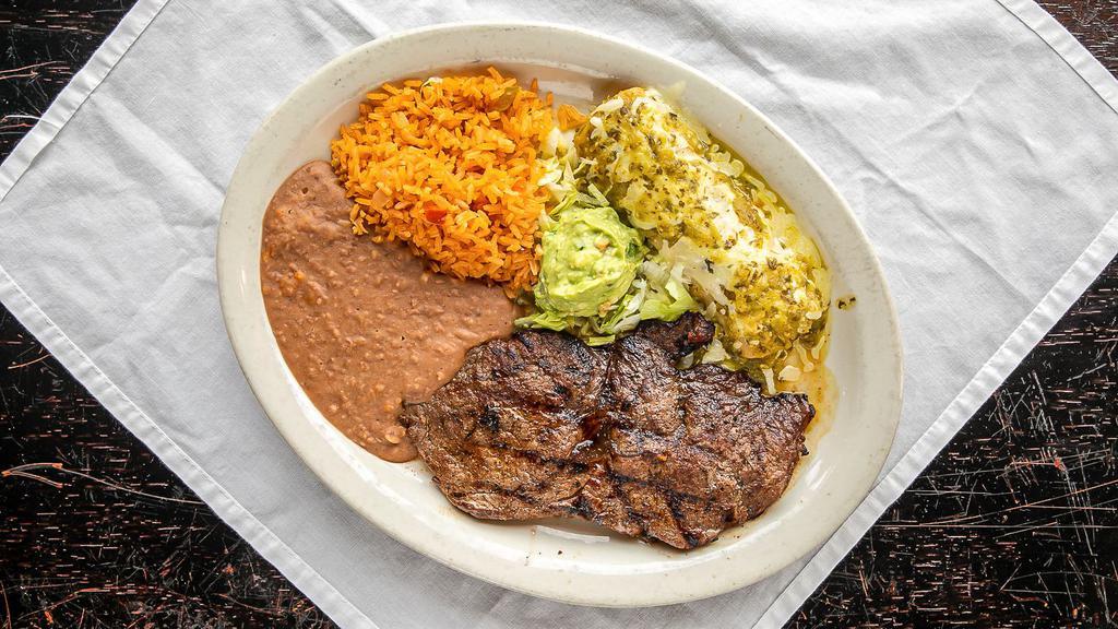 Carne Asada · A tender grilled 8.5 oz round top sirloin steak, charbroiled, then, served with a side of guacamole, pico de gallo, and one enchilada of your choice, topped with choice of sauce.